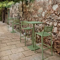 Tonik table tops and chairs by Fast in an outdoor patio area